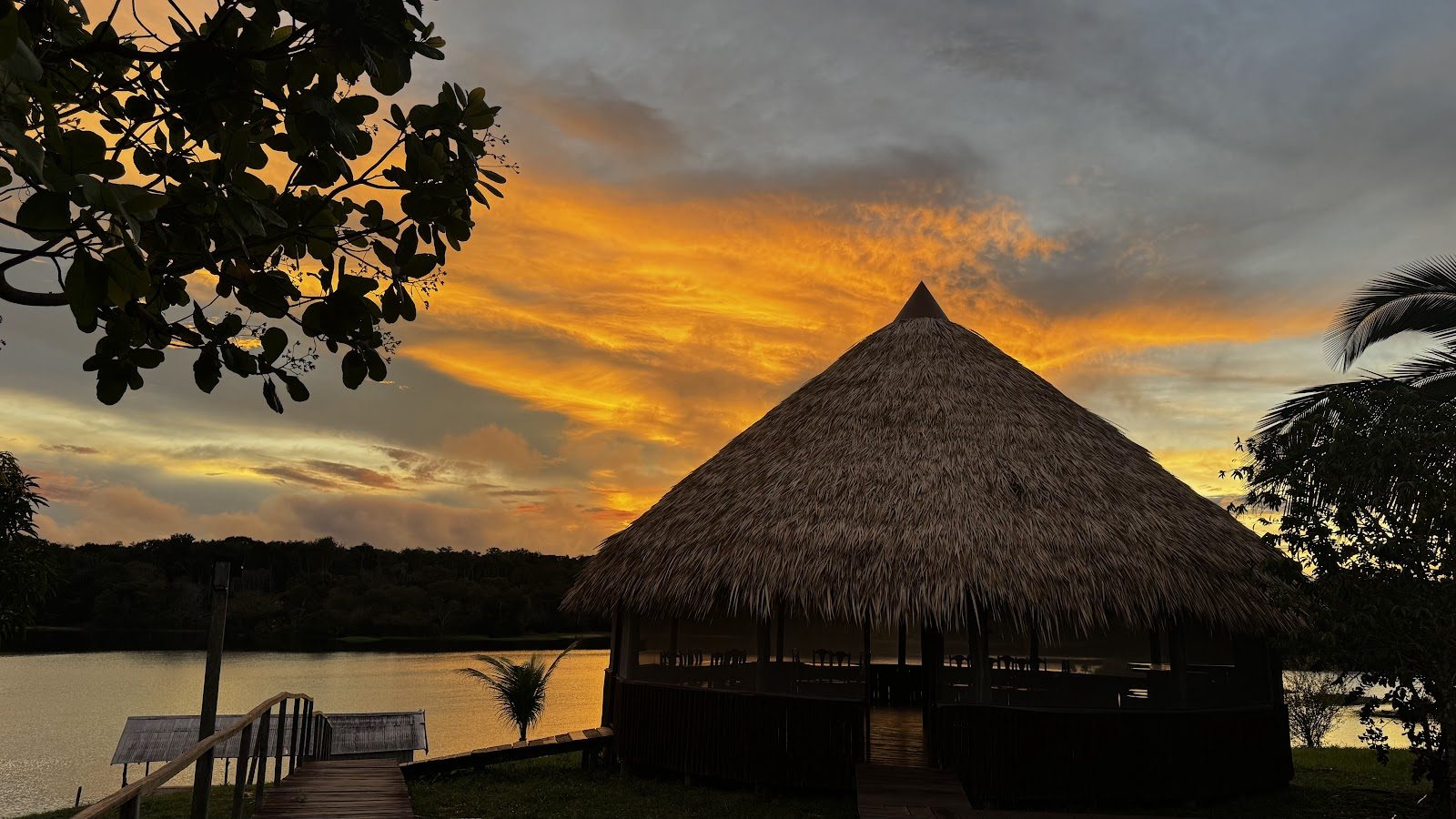 Thatched pavilion at sunset