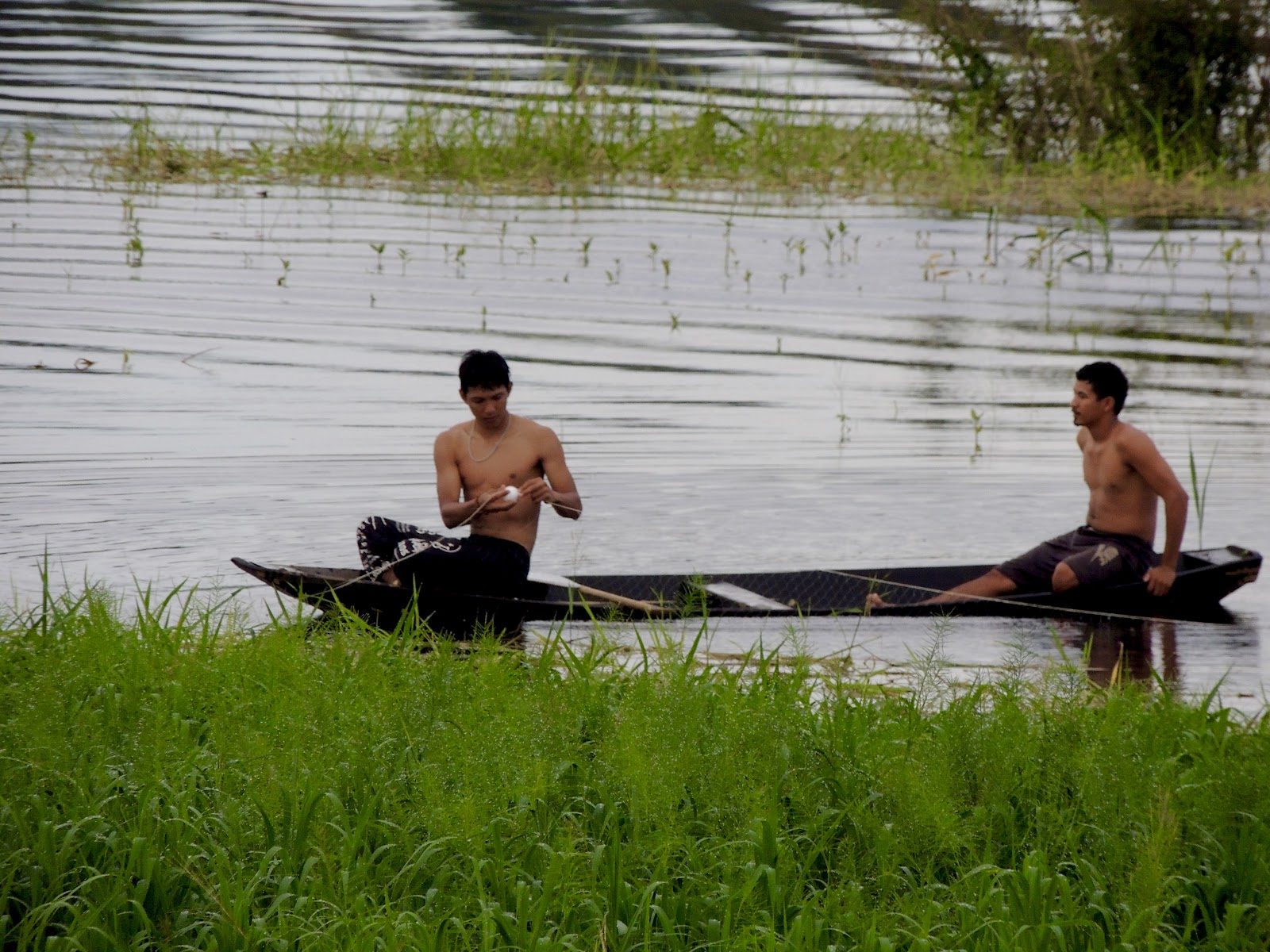 Local fishermen in a canoe